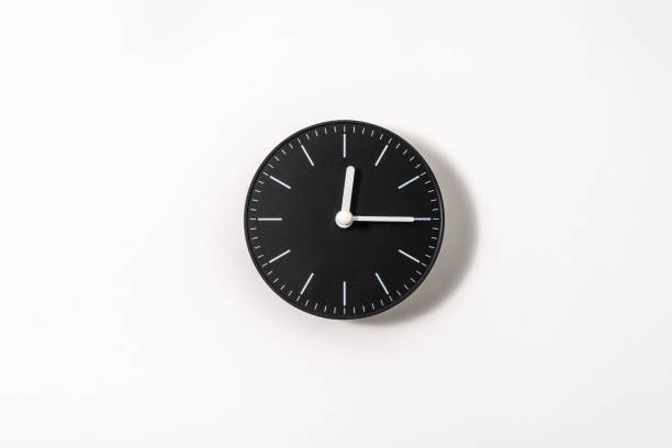 istock close up of an office clock on white background with clipping path 1291403693