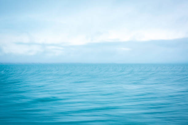 istock Motion Blur Stormy Ocean and Clouds Background 1291404283