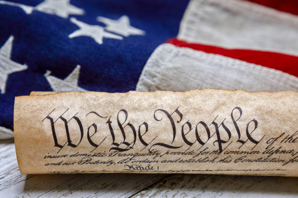 istock U.S. Constitution Rolled Up on an American Flag 1291408486
