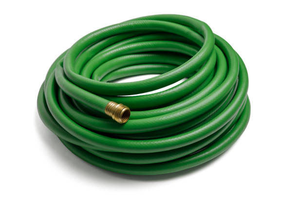 Green Garden Hose Isolated on White New green rolled up rubber garden hose isolated on a white background garden hose photos stock pictures, royalty-free photos & images