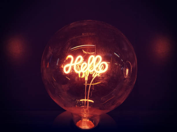 neon script hello lamp a warm gold light lamp with neon script word hello glowing in the dark, home design decore crystal ball photos stock pictures, royalty-free photos & images