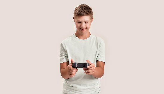 Immersed in the world of video games, the mid adult man and his son share laughter, excitement, and unforgettable moments, their eyes fixed on the screen, their joysticks bringing the virtual world to life