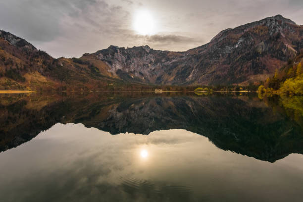 istock weak sun in a colorful autumn landscape on a mountain lake 1291413669