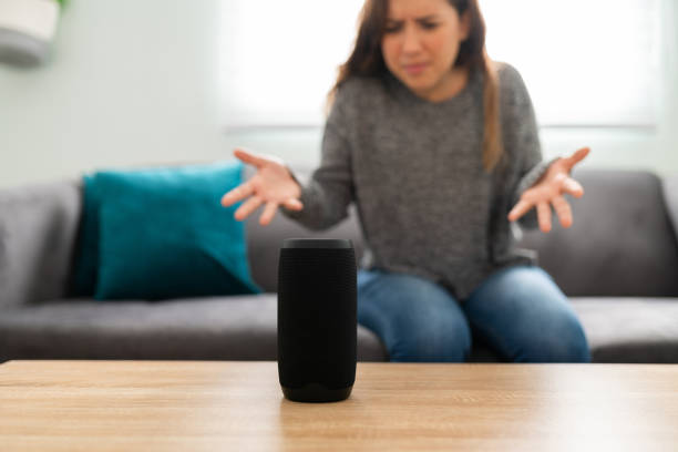 Stressed woman trying to connect her smart speaker that is not working