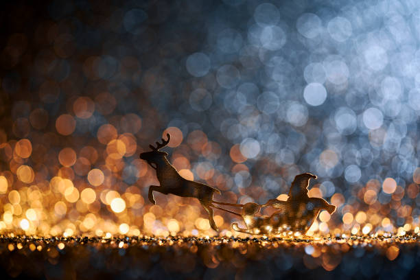 istock Christmas Santa Sleigh and Reindeer - Backgrounds Defocused 1291415819
