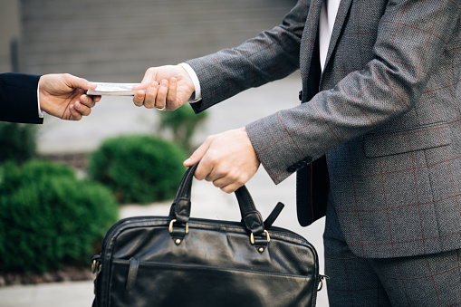Two unrecognized business partners shaking hands. Colleagues just made good deal. Business relationship. Successfully made deal. Handshake - business people shaking hands.