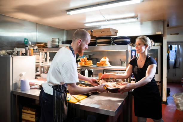 istock Kitchen Staff Preparing a Sunday Roast 1291418642