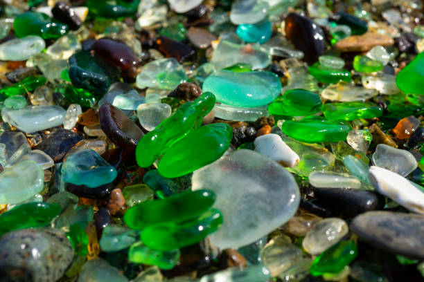 istock Natural background with sea glass close-up on sand. 1291420129