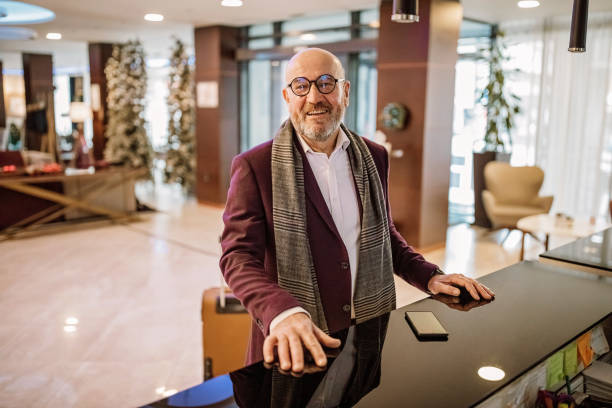 istock Senior businessman checking out from hotel 1291421448