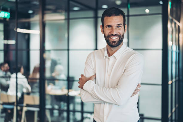 istock Portrait of a businessman inside modern office 1291422499