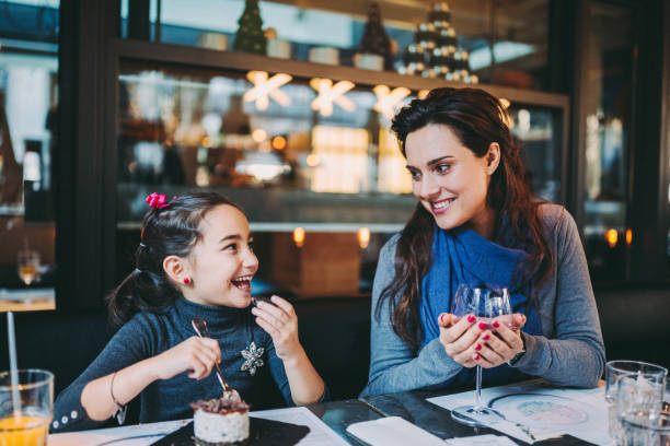 istock Family eating in restaurant 1291424052