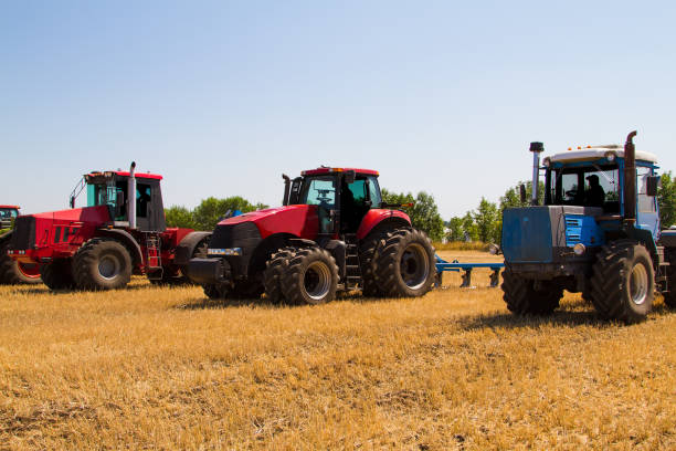 istock Agricultural tractor plowing a field 1291424451