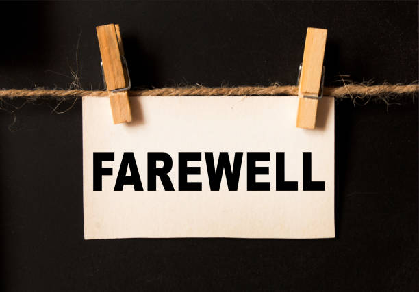 istock a sheet on a black background with text FAREWELL. business concept 1291427287