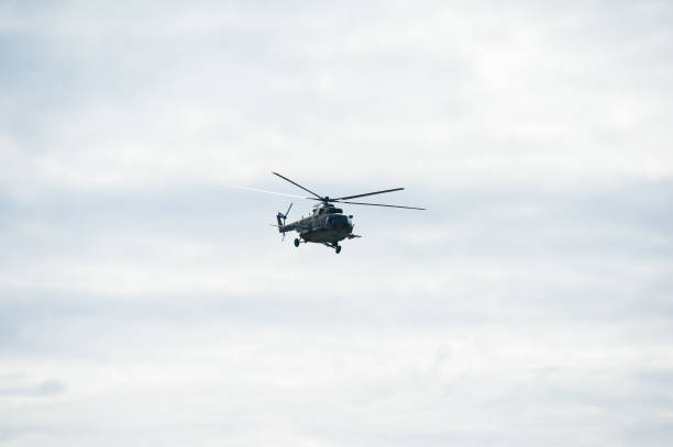 istock Military helicopter flying during exercise 1291428463