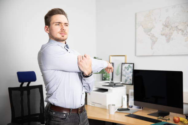 istock Young businessman pays attention to exercise in the workplace. 1291428588