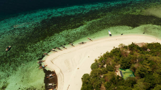 istock Tropical island with sandy beach. Mantigue Island, Philippines 1291428779