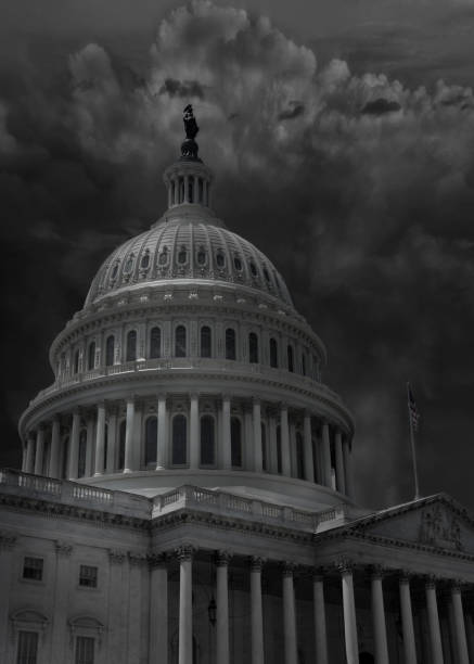 istock The Capitol building in Washington DC with dark storm clouds 1291428988