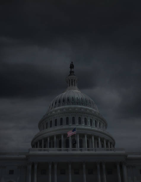 istock Dark storm clouds over the US Capitol building in Washington DC 1291429001