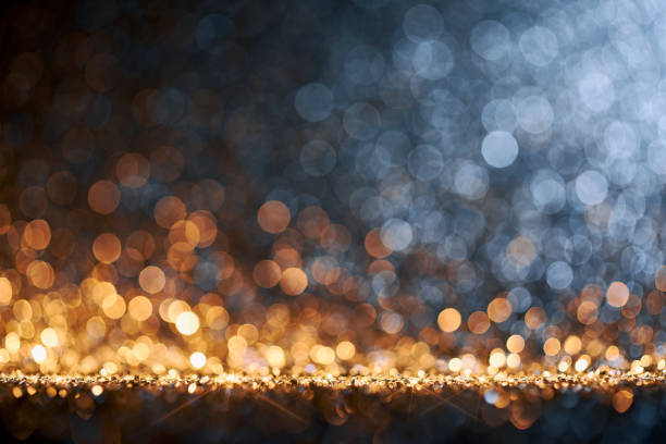 istock Shiny bokeh background -  Gold Blue Christmas Holiday Background Defocused 1291434478
