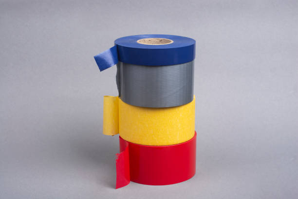 istock Several rolls of duct tape on a gray background. 1291436075