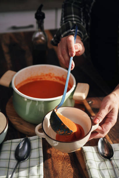 istock Preparing Delicious Tomato Soup in Domestic Kitchen 1291436952