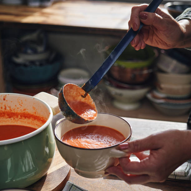 istock Preparing Delicious Tomato Soup in Domestic Kitchen 1291437069