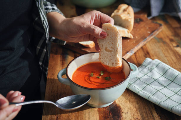 istock Preparing Delicious Tomato Soup in Domestic Kitchen 1291438205