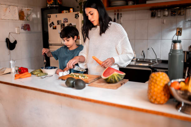 istock Family time spending in the kitchen, preparing the meal 1291440754
