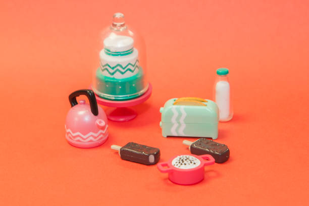 istock plastic toy tableware with classic bitten popsicles choc-ice Lollipop ice cream in chocolate glaze on pastel orange background 1291444885