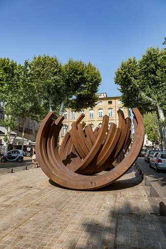 Aix en Provence, France - July 8, 2015: Modern street art by French conceptual artist Bernar Venet a series of steel Arc sculpture this at the cultural center Aix en Provence, France.