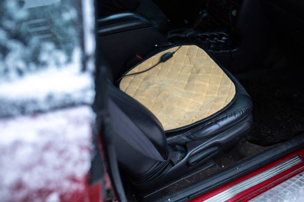 istock portable heated seat in a car with a leather seat. 1291449452