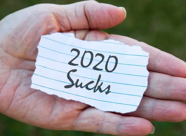 Paper note in hand, 2020 sucks.
