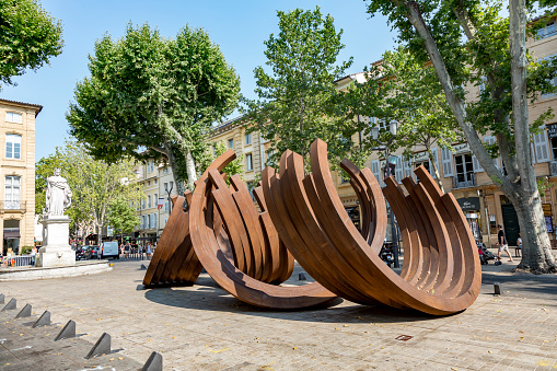 Aix en Provence, France - July 8, 2015: Modern street art by French conceptual artist Bernar Venet a series of steel Arc sculpture this at the cultural center Aix en Provence, France.