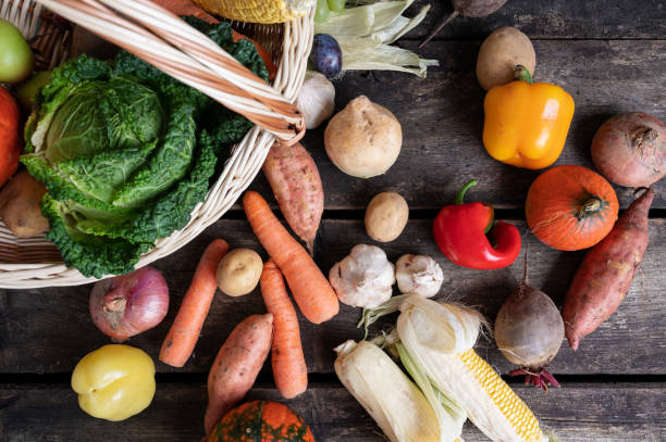 istock Top view of various autumn vegetables in a wicker basket 1291452276