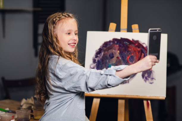 istock a young charming artist leads an online masterclass in drawing pictures in her workshop 1291453113