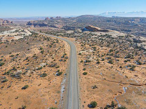 Aerial top view of Scenic highway through desert of Utah, USA. Horizon view.