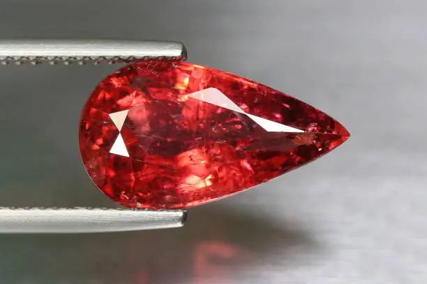 natural red tourmaline the grey background
