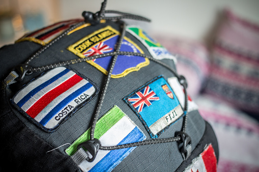 Close up of patches showing national flags sewn onto a backpack.