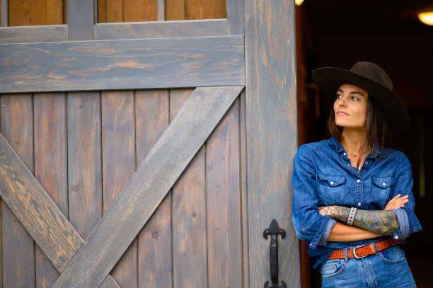 istock Modern cowgirl at the ranch 1291460779