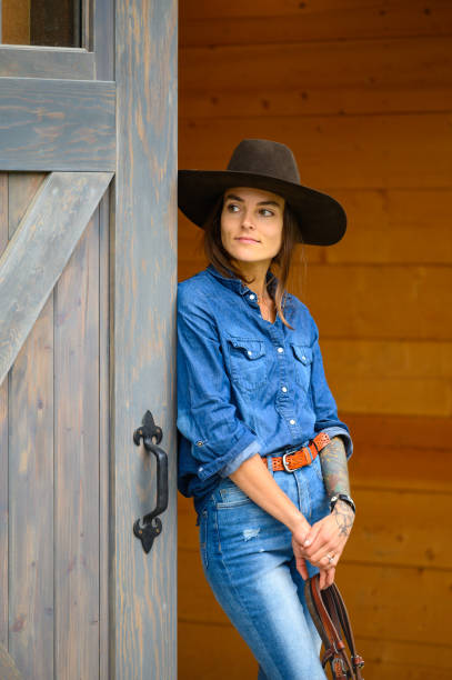 istock Modern cowgirl at the ranch 1291460785