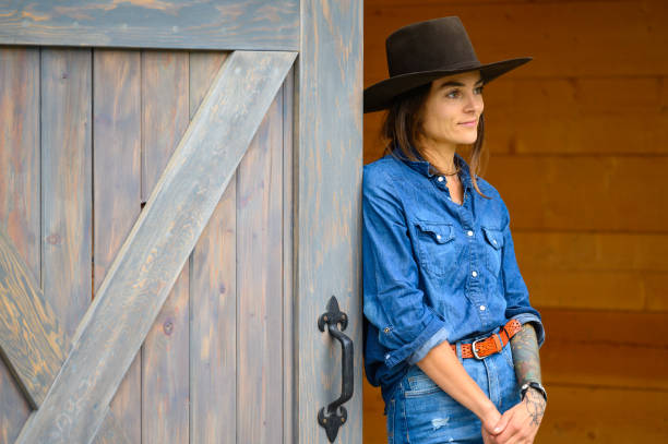 istock Modern cowgirl at the ranch 1291460907