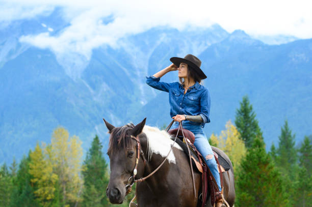 istock Woman riding her horse at a ranch 1291460985