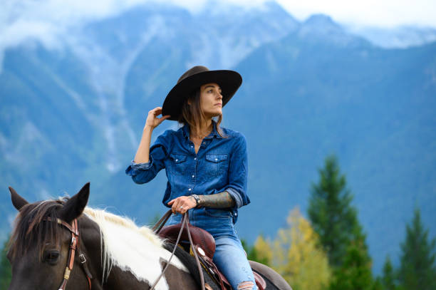 istock Woman riding her horse at a ranch 1291461111