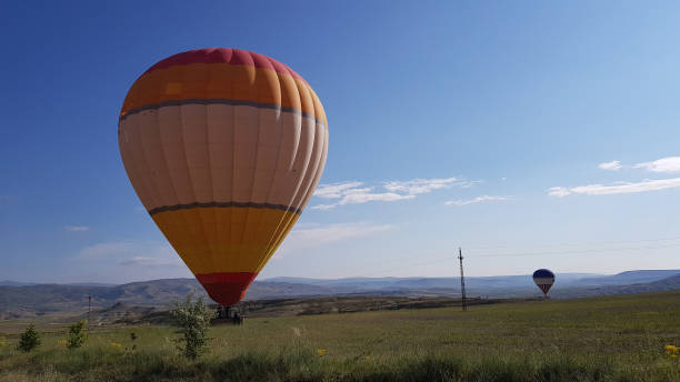 istock Hot air balloon and Cloudy sky at sunrise 1291462556