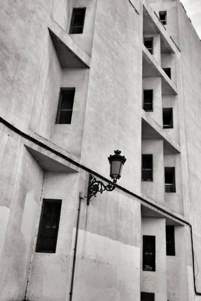 istock White facade with windows and vintage lamp 1291464397