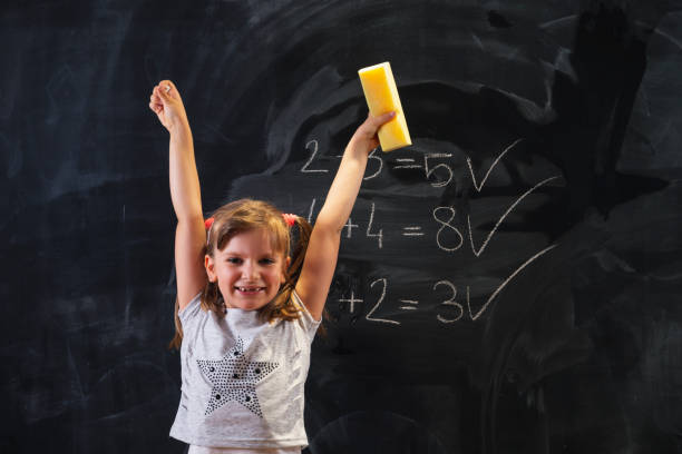 istock Schoolgirl happy after getting an A in math 1291464446