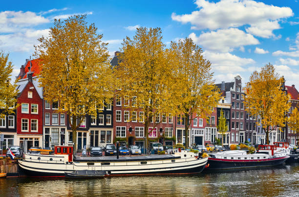 istock Bridge over channel in Amsterdam Netherlands houses river Amstel 1291471810