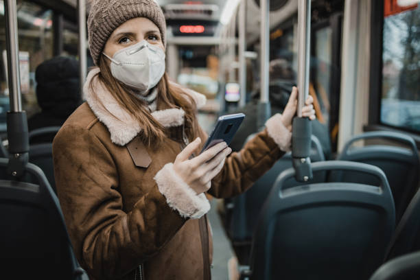 istock A woman with a face mask on public transportation 1291473967