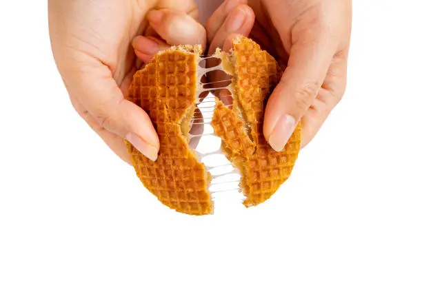 Isolated die cut clipping path signature authentic Dutch Netherlands sweet dessert waffle caramel honey sugar syrup for coffee tea call Stroopwafel