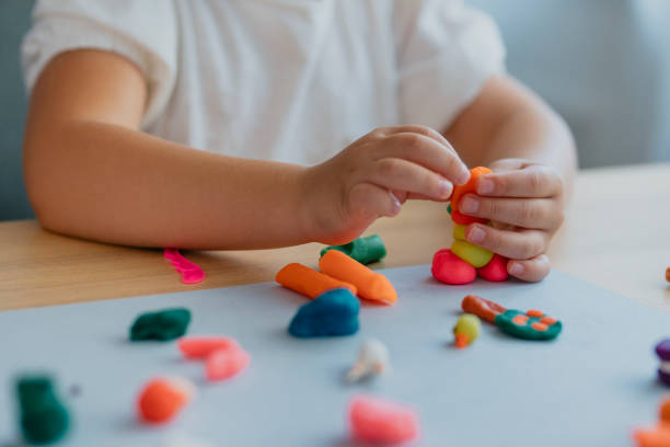 istock Unrecognizable Girl Playing with Plasticine 1291476307